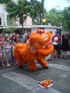 Lion dances to the oranges