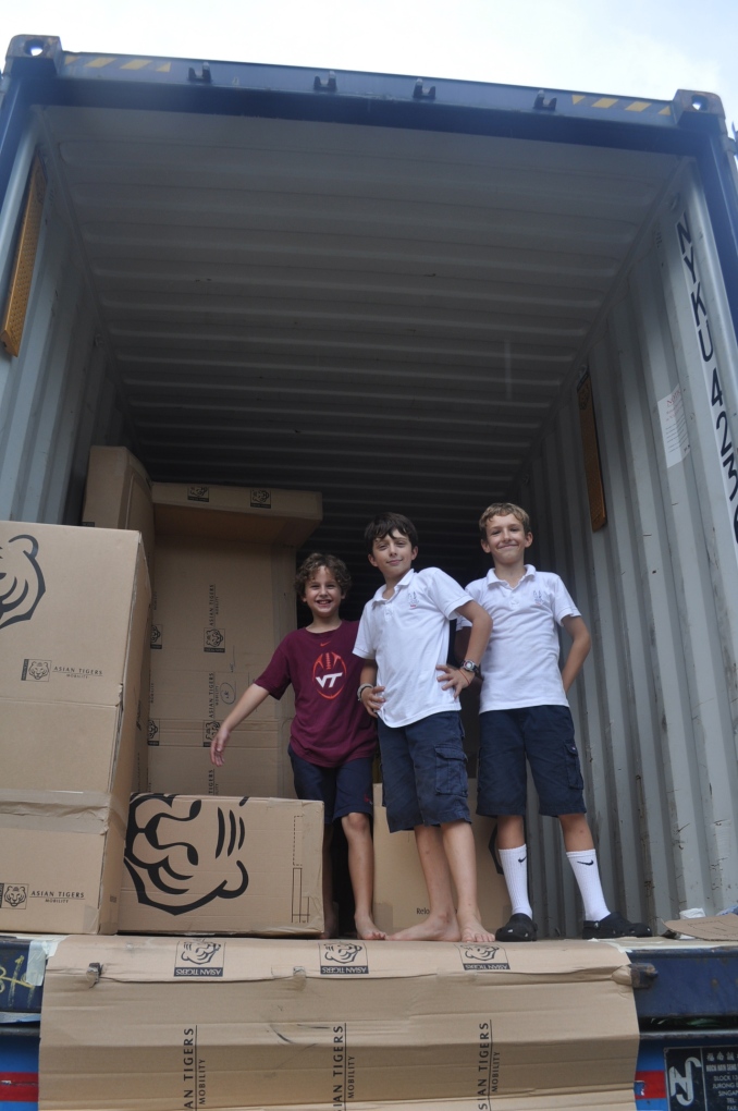Ben, Alex and Davis getting packed away in our container!